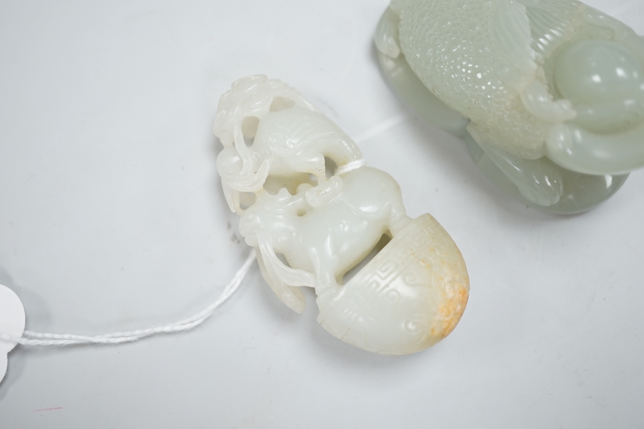 A Chinese green jade figure of a three legged toad and a Chinese pale celadon jade group of a crane and a deer in archaic style, toad carving 6.5cm long (2)